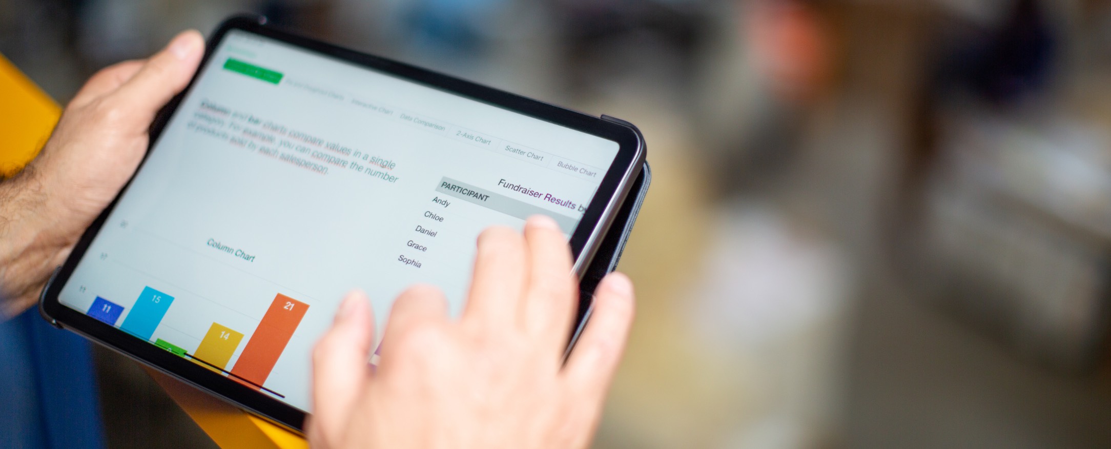 Person analyzing data on a tablet, representing CloudResearch's MicroBatch feature which is now offered as a Pro feature with updated pricing structure